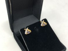 A pair of yellow gold tanzanite and diamond earrings