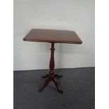 A teak and mahogany occasional table