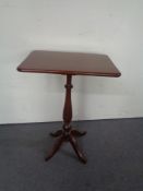 A teak and mahogany occasional table