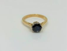 An 18ct gold sapphire solitaire ring, size L CONDITION REPORT: 3.