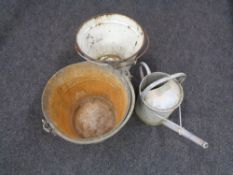 An enamelled bucket and galvanised watering can