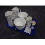 A tray of three Coalport pageant graduated jugs, two planters,