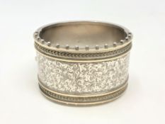 A fine late Victorian silver cuff bangle with engraved decoration CONDITION REPORT: