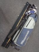 A golf bag of Hausen irons and drivers and a Riley two piece snooker cue in bag,