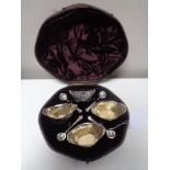 A set of four silver salts with spoons, London 1887, Walter & John Barnard.