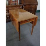 An antique mahogany Pembroke table