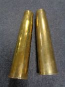 A pair of large brass ammunition shells