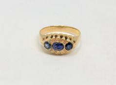 An 18ct gold sapphire and diamond ring, size Q CONDITION REPORT: 2.