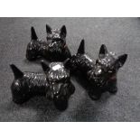 A tray of three pottery Scotty dogs