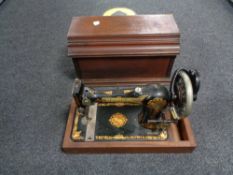 A vintage Jones Medimcs sewing machine in case