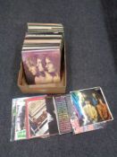 A box of vinyl LP records - Eric Clapton, Queen, The Beatles, 10 CC,