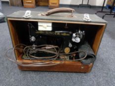 A cased Singer sewing machine (electrified)