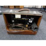 A cased Singer sewing machine (electrified)