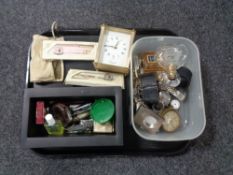 A tray of assorted wristwatches, perfume bottles, mantel clock, travel clock, pocket knives etc.