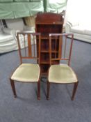 A pair of inlaid mahogany occasional chairs and open bookcase