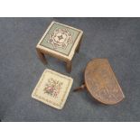 A carved milking stool (leg needing attention) and two other stools