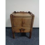 A George III mahogany double door commode cabinet on raised legs