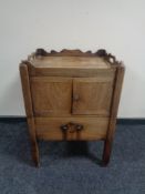 A George III mahogany double door commode cabinet on raised legs