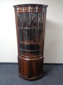 A mahogany Regency style corner display cabinet