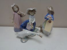 Three Nao figures, girl with basket,