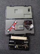 A Playcom Digital Planimeter, in fitted carry case, together with Allbert measuring wheel,