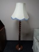 An early twentieth century barley twist standard lamp with shade