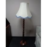 An early twentieth century barley twist standard lamp with shade