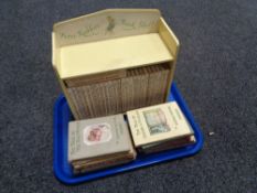 A tray of Peter Rabbit bookshelf together with a quantity of Beatrix potter books