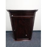 A Victorian style mahogany corner cabinet