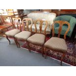 Four early 20th century walnut dining chairs