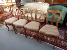 Four early 20th century walnut dining chairs