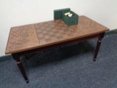 A set of Regency Fine Art chess pieces and a chess board topped coffee table