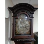 An antique painted continental clock with brass and enamelled dial,