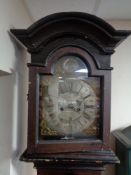 An antique painted continental clock with brass and enamelled dial,