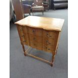 A blonde oak three drawer chest