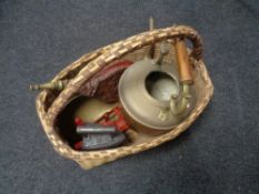 A wicker basket of large copper kettle, flat iron, vintage kitchen scales,