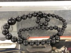 A Whitby Jet beaded necklace CONDITION REPORT: 90cm long. Clasp a/f.