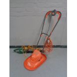 A Performance hedge trimmer and a Flymo mower