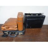 Two vintage brown leather brief cases together with two black leather cases