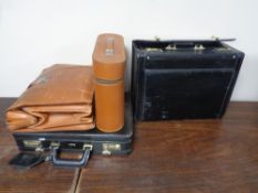 Two vintage brown leather brief cases together with two black leather cases