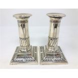 A pair of loaded silver candlesticks, maker T.A.S., Sheffield 1903, height 13.5cm.