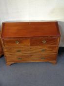 A late 19th century mahogany bureau on bracket feet