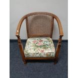 An early twentieth century bergere backed armchair