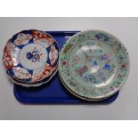 A tray of two Imari wall plates together with two Chinese famille rose plates