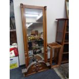 An antique mahogany hall mirror with column supports