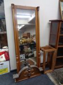 An antique mahogany hall mirror with column supports