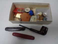 A box of pocket compasses, medals, enamelled badges, cuff links,