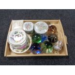 A tray of glass paperweights, china trinket boxes,
