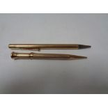 Two 9ct gold mechanical pencils.