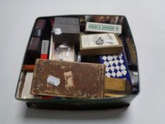 A box of playing cards, brass ware, pocket knife,